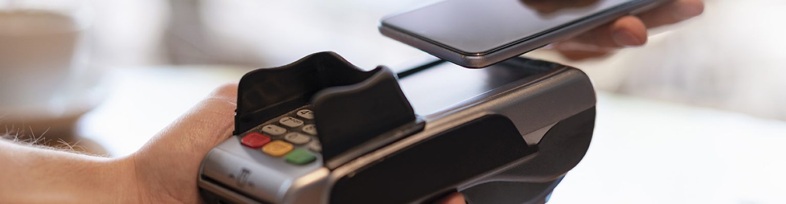 Contactless payment with smartphone, close-up